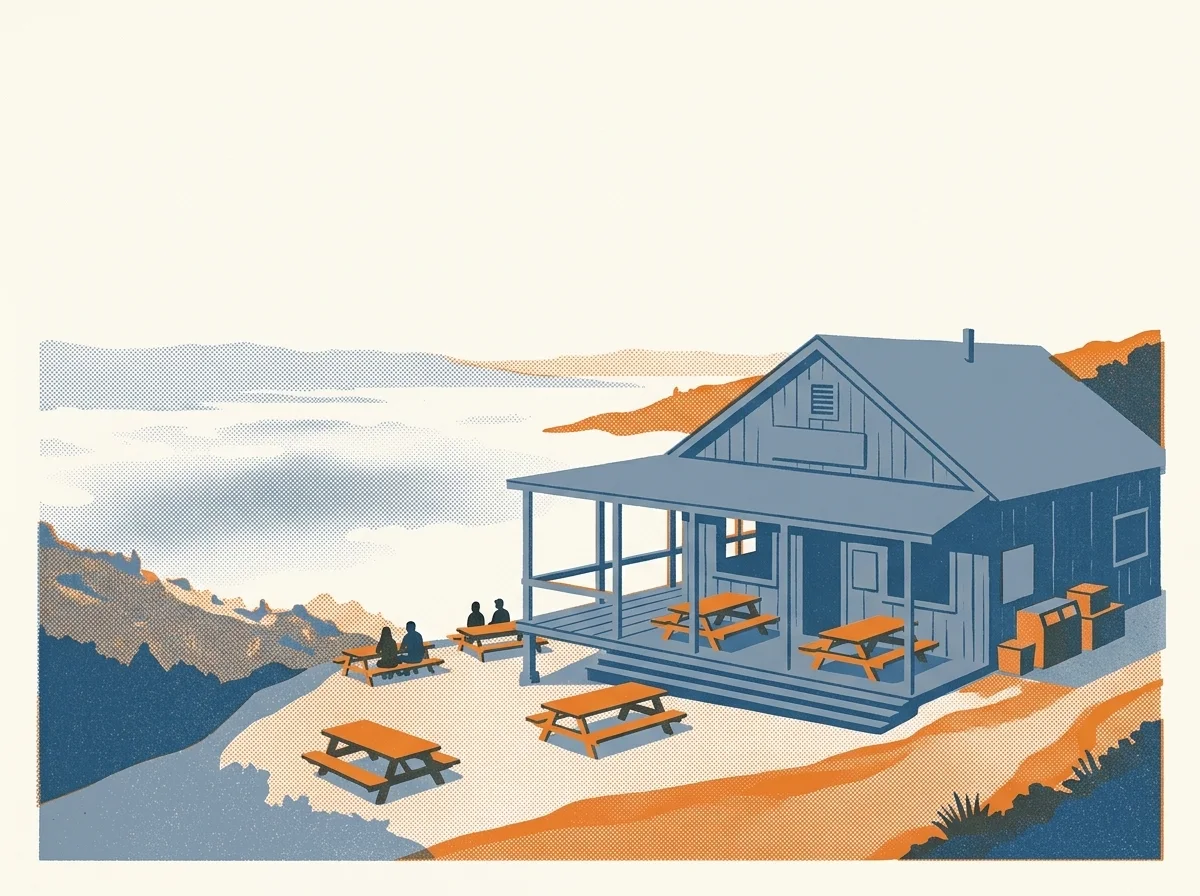 Illustration of a rustic mountain inn with a deck above the fog